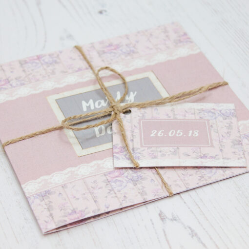 Close up of Folded Dusky Dream Wedding Invitations with String & Tag