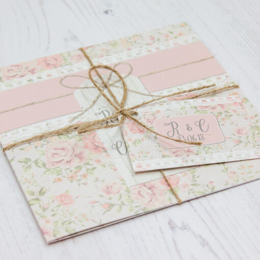 Close up of Folded Summer Breeze Wedding Invitations with String & Tag